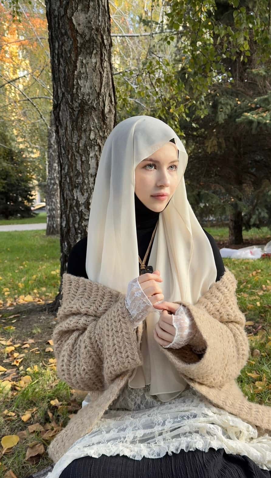 Amina sitting in a peaceful park